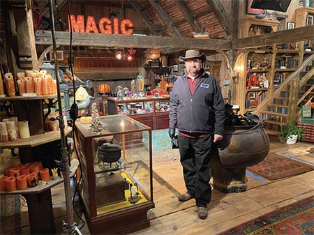 Steven standing on set created for old witchcraft shop